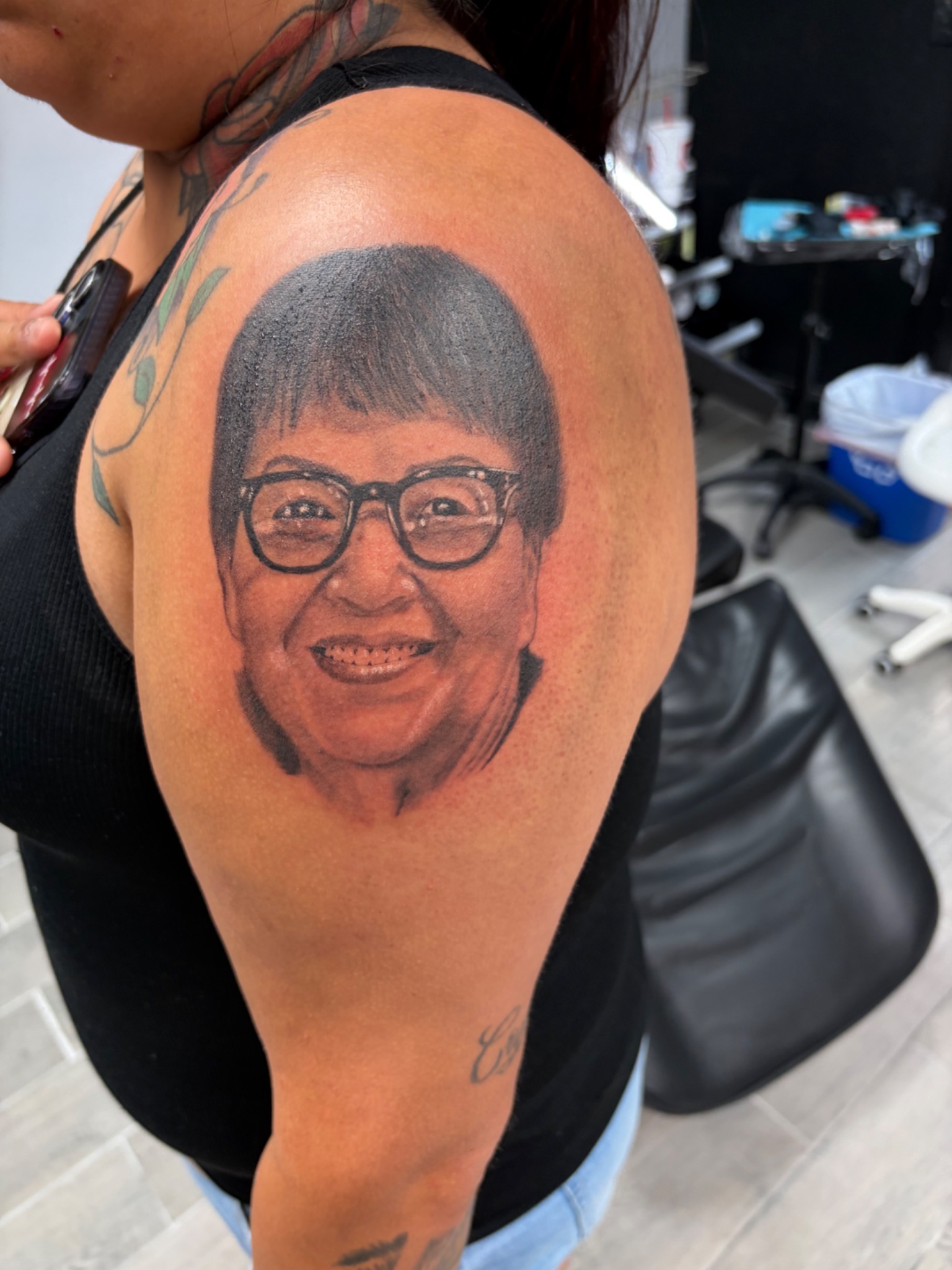 Black and grey shoulder memorial portrait tattoo